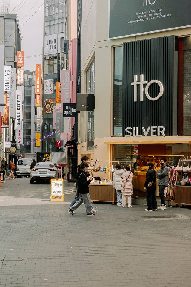 Myeongdong shopping street bustling with stores and neon signs